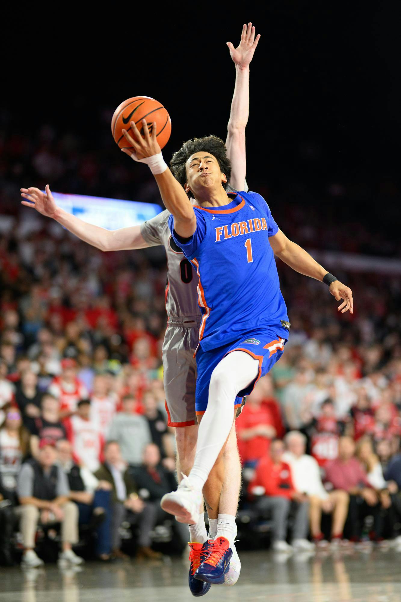 Florida guard Xaivian Lee (1) shoots a layup during the first half of an NCAA college basketball game against Georgia, Wednesday, Feb. 11, 2026, in Athens, Ga.
