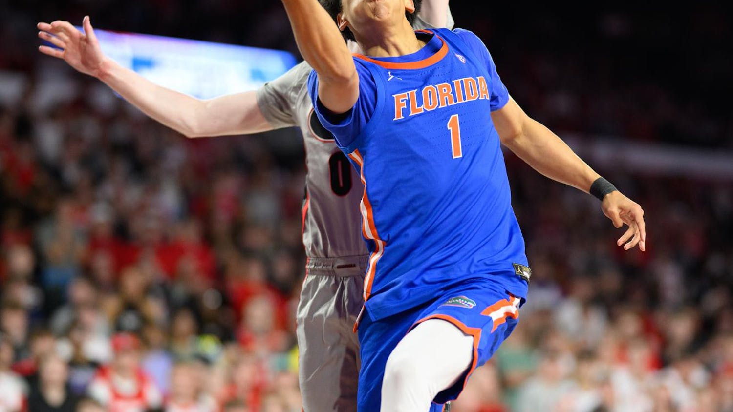 Florida guard Xaivian Lee (1) shoots a layup during the first half of an NCAA college basketball game against Georgia, Wednesday, Feb. 11, 2026, in Athens, Ga.