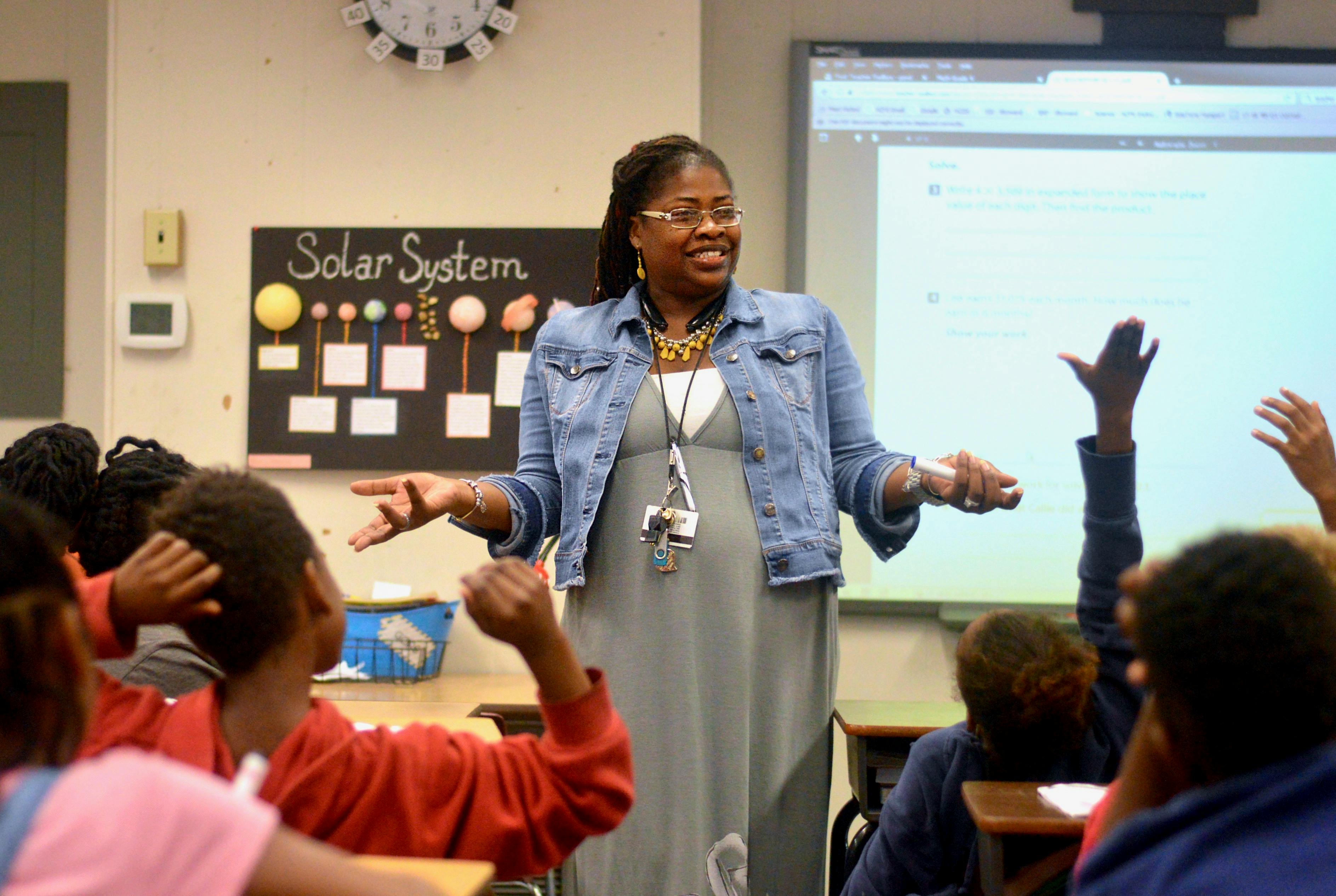 [FILE PHOTO] 35-year-old Lilliemarie Gore leads students of Idylwild Elementary School through a series of math exercises. Mrs. Gore was awarded the title of "2017-2018 Alachua County Teacher of the Year" earlier this month. 