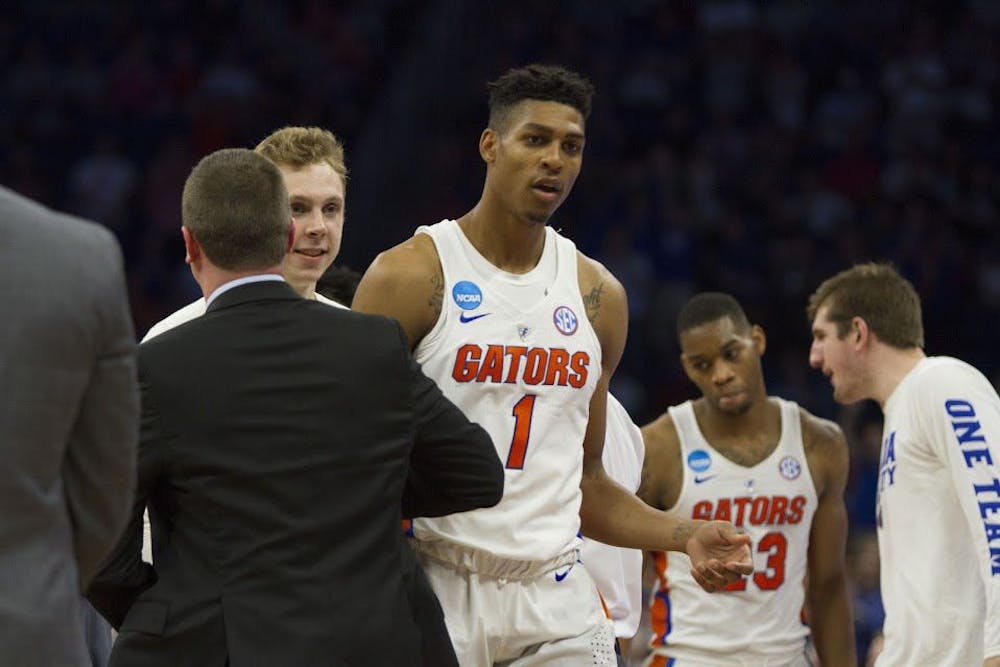<p>UF forward Devin Robinson walks off the court during Florida's 65-39 win against Virginia in the NCAA Tournament on Saturday in Orlando.</p>