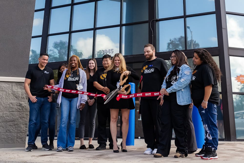 <p>Center manager Faye-Lynn cuts a ceremonial ribbon at the grand opening for BioLife Plasma Services on Nov. 4, 2024.</p>