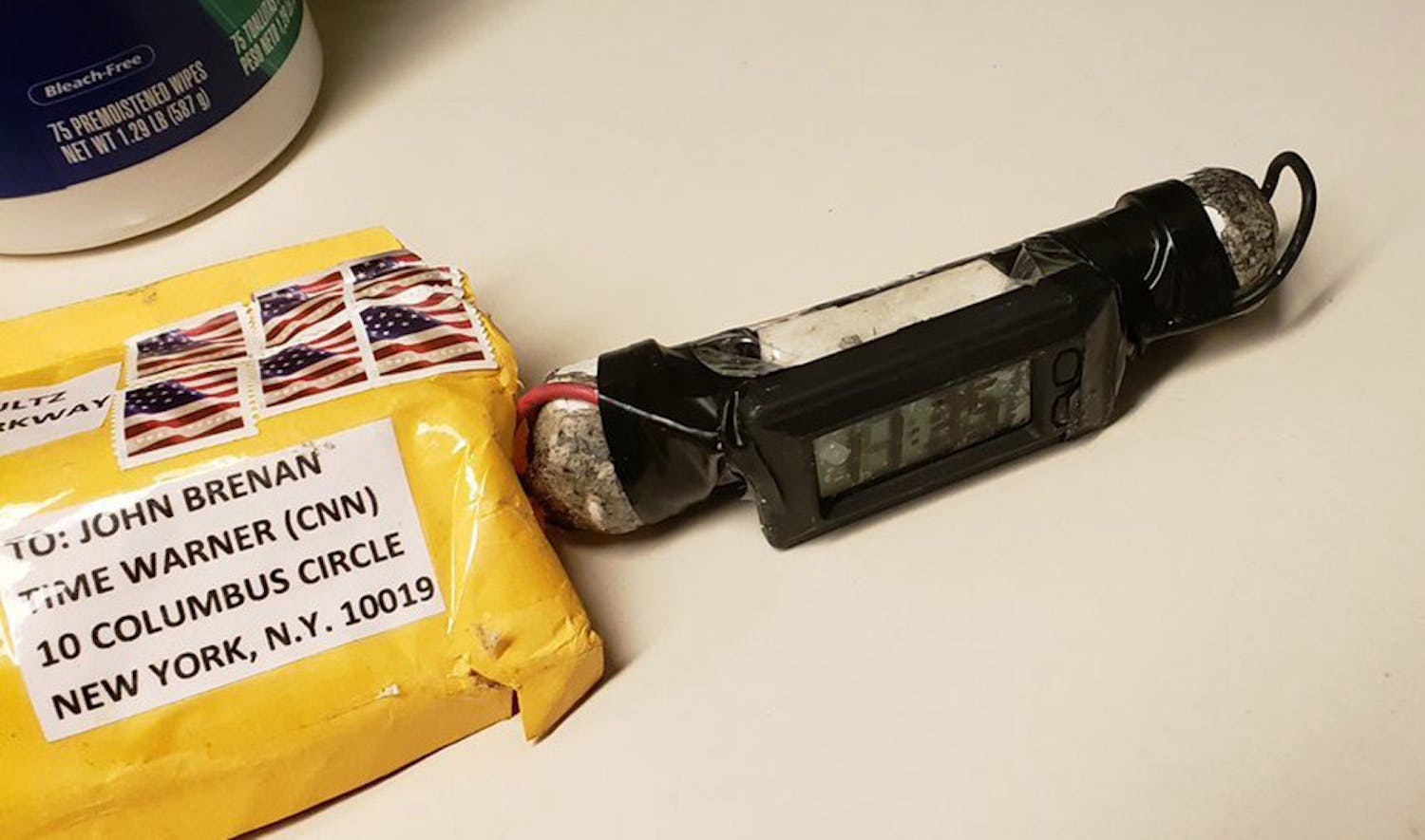 This image obtained Wednesday, Oct. 24, 2018, and provided by ABC News shows a package addressed to former CIA head John Brennan and an explosive device that was sent to CNN's New York office. The mail-bomb scare widened Thursday as law enforcement officials seized more suspicious packages.