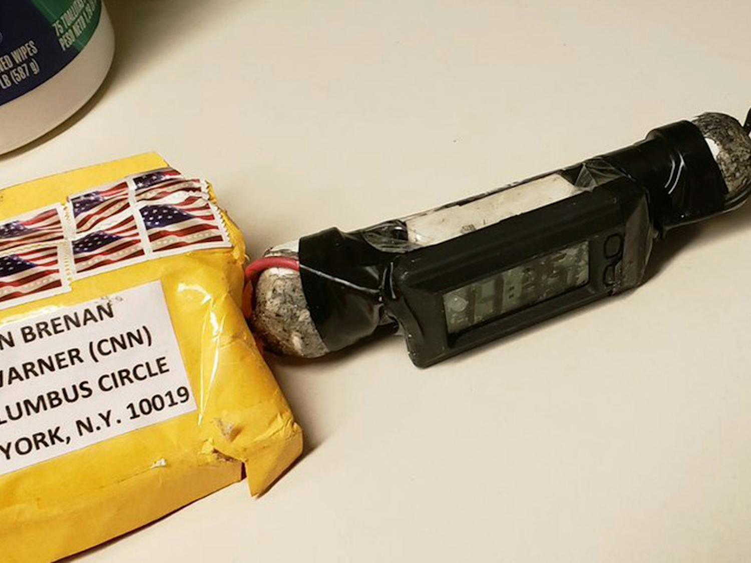 This image obtained Wednesday, Oct. 24, 2018, and provided by ABC News shows a package addressed to former CIA head John Brennan and an explosive device that was sent to CNN's New York office. The mail-bomb scare widened Thursday as law enforcement officials seized more suspicious packages.