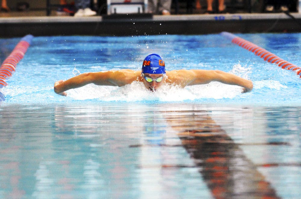 <p>Jan Switkowski races in the 200 meter butterfly during Florida’s meet against Auburn on Jan. 23, 2016, in the O’Connell Center.</p>