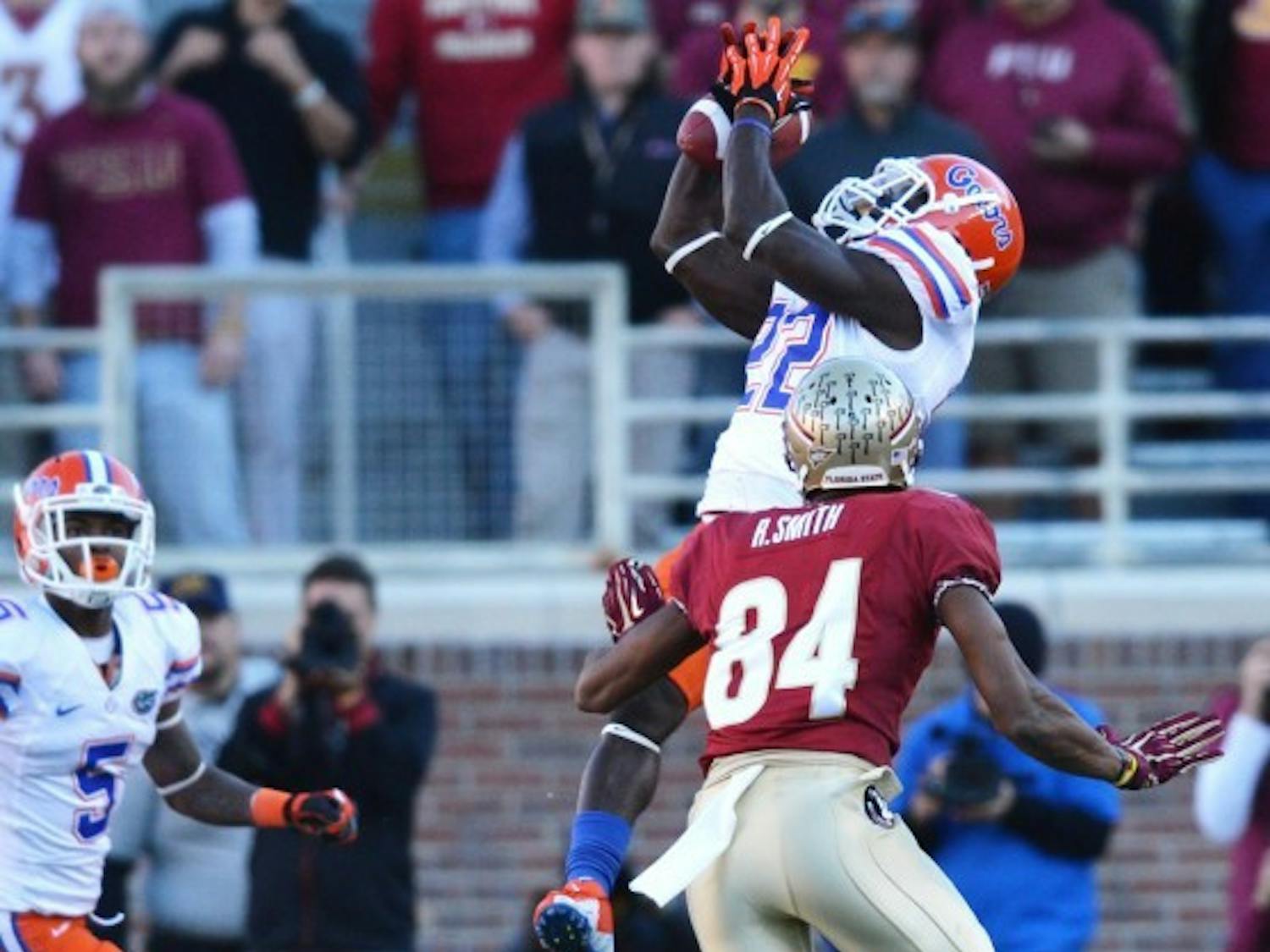 Safety Matt Elam intercepts a pass thrown by EJ Manuel during Florida’s 37-26 win against Florida State on Saturday at Doak Campbell Stadium in Tallahassee.

