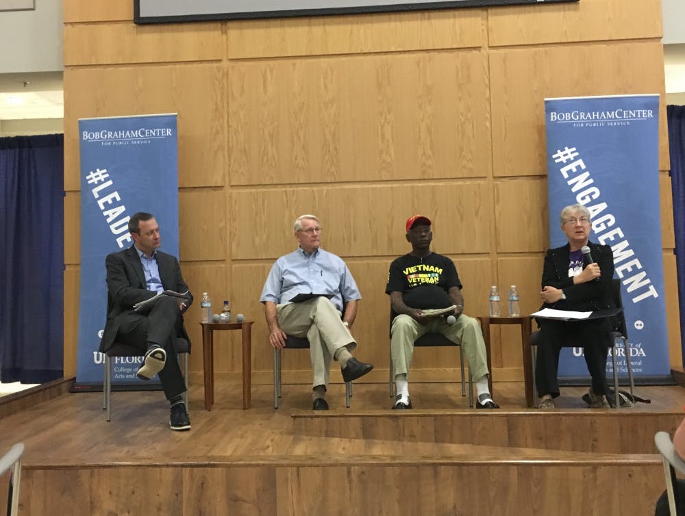 Three Vietnam War veterans spoke at 6 p.m. Tuesday at Pugh Hall Ocora for a panel discussion called “Revisiting the Vietnam War.” The moderator Matthew Jacobs, a UF history associate professor, spoke to panelists John LeMoyne, Cornelius Clayton and Mary Bahr. 