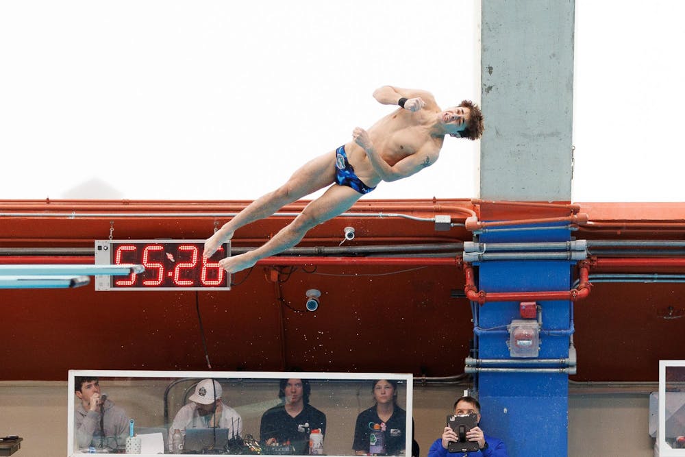 Conor Gesing dives during a meet between the Florida Gators and Florida State Seminoles on Friday, Jan. 30, 2026, in Gainesville, Fla.