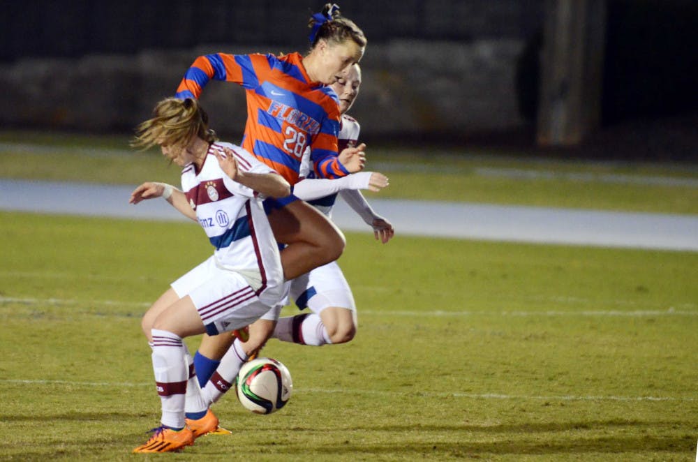 <p>UF midfielder Meggie Dougherty-Howard dribbles during Florida's 4-0 loss to FC Bayern Munich on Saturday at James G. Pressly Stadium.</p>