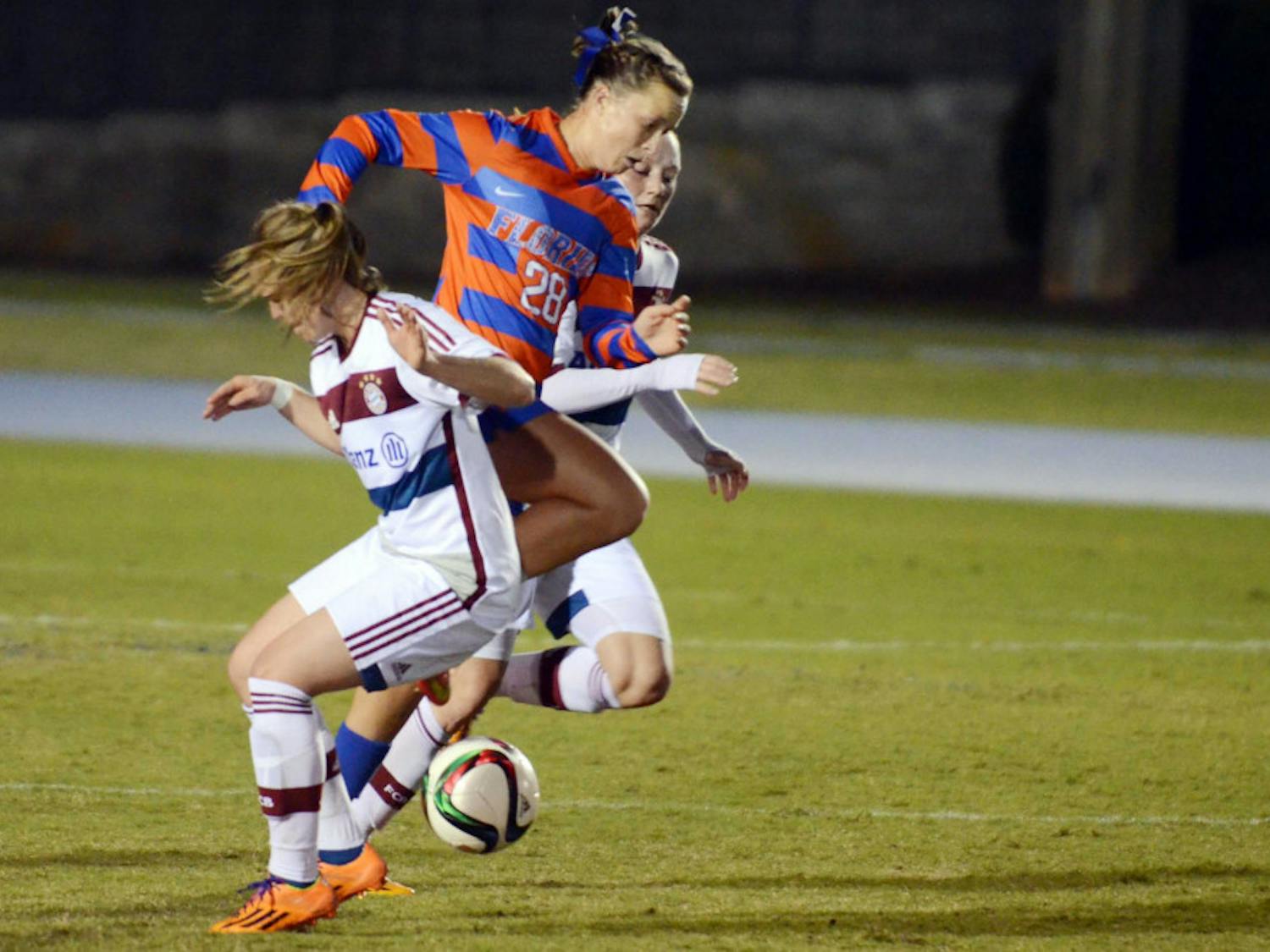 UF midfielder Meggie Dougherty-Howard dribbles during Florida's 4-0 loss to FC Bayern Munich on Saturday at James G. Pressly Stadium.