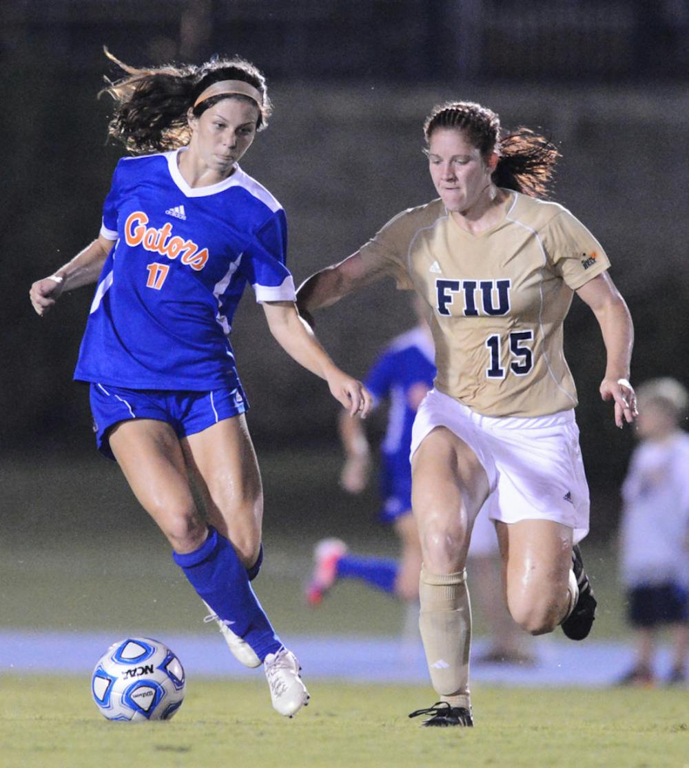 <p>Erika Tymrak (17) battles with Crystal McNamara (15) of Florida International University during Florida's 3-0 win on Sept. 2 at James G. Pressly Stadium. Tymrak is one of three Florida seniors to earn All-Southeastern Conference first team. She also won SEC Offensive Player of the Year.</p>