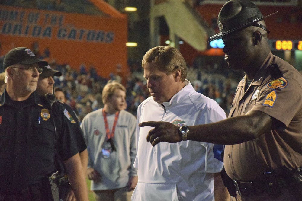 UF Jim McElwain walks off the field following Florida's 27-2 loss to Florida State on Nov. 28, 2015, at Ben Hill Griffin Stadium.
