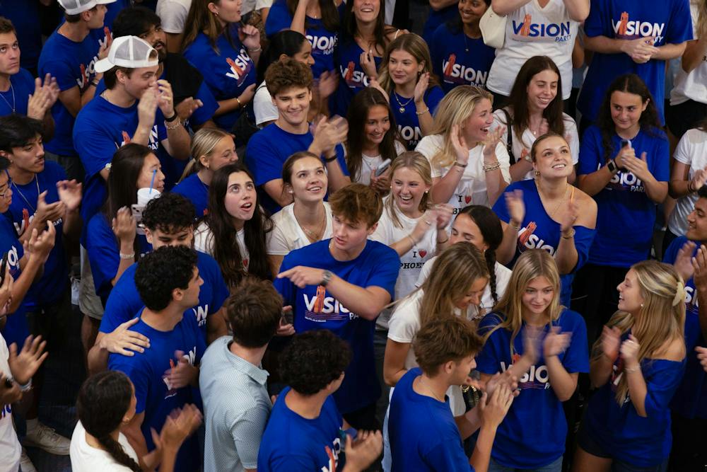 As election results begin coming in, members of Vision Party cheer in the Reitz Union on UF's campus, Wednesday, Sept. 30, 2026.