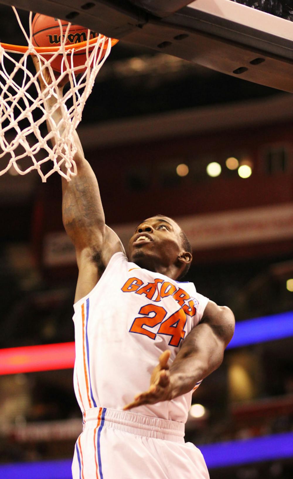 <p>Forward Casey Prather finishes a layup at the rim during Florida's 78-61 win against Air Force on Dec. 29 at the Orange Bowl Classic in Sunrise.</p>