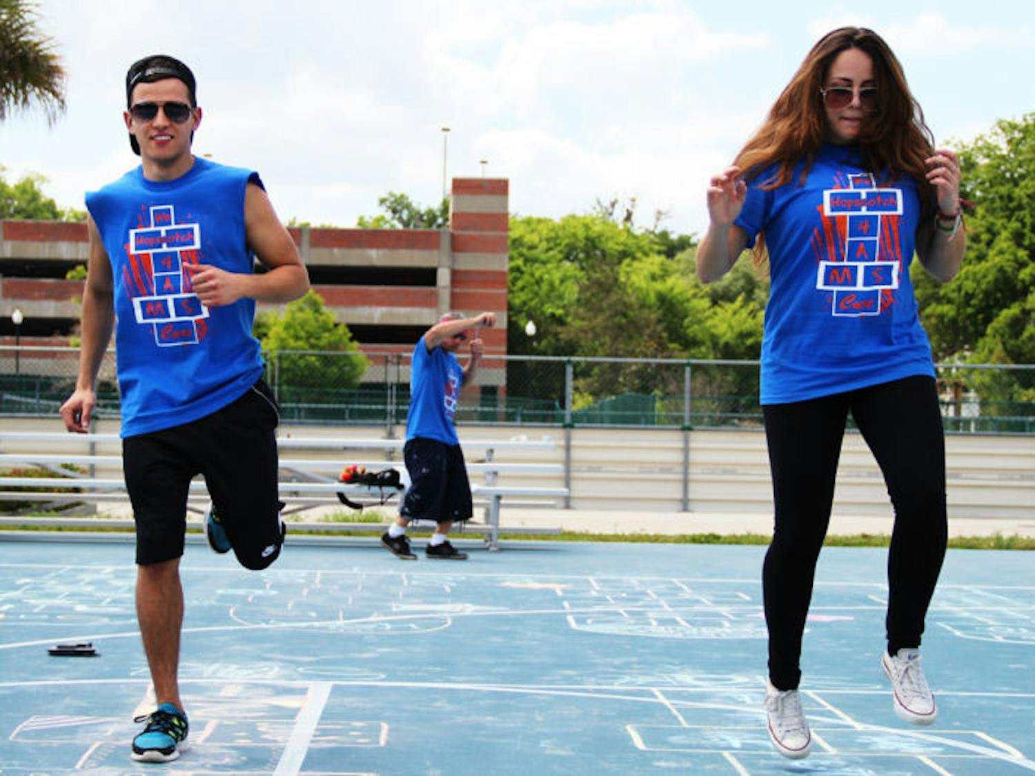 Alejandro Saenz, 19, and Sophia Hannabergh, 19, hopscotch at UF’s Hopping 4 A Cure tournament at the Broward Hall Outdoor Recreation Complex on Sunday afternoon.