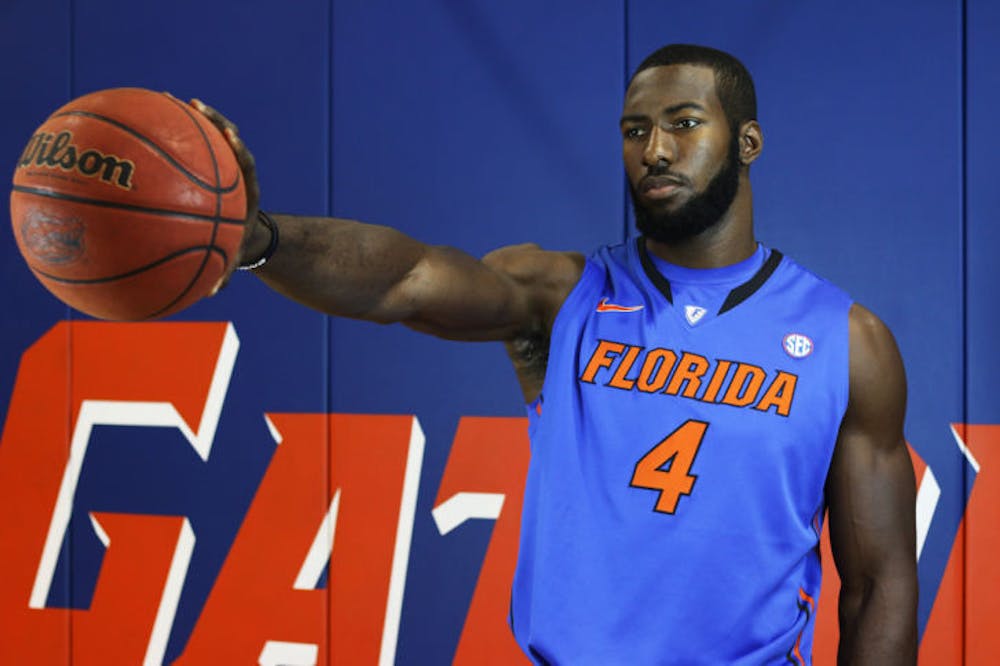 <p>Patric Young poses for a photo during Florida’s basketball media day. The senior center, who averaged 10.1 points and 6.9 rebounds per game last season, is hoping to help the Gators improve on defense in 2013-14.</p>