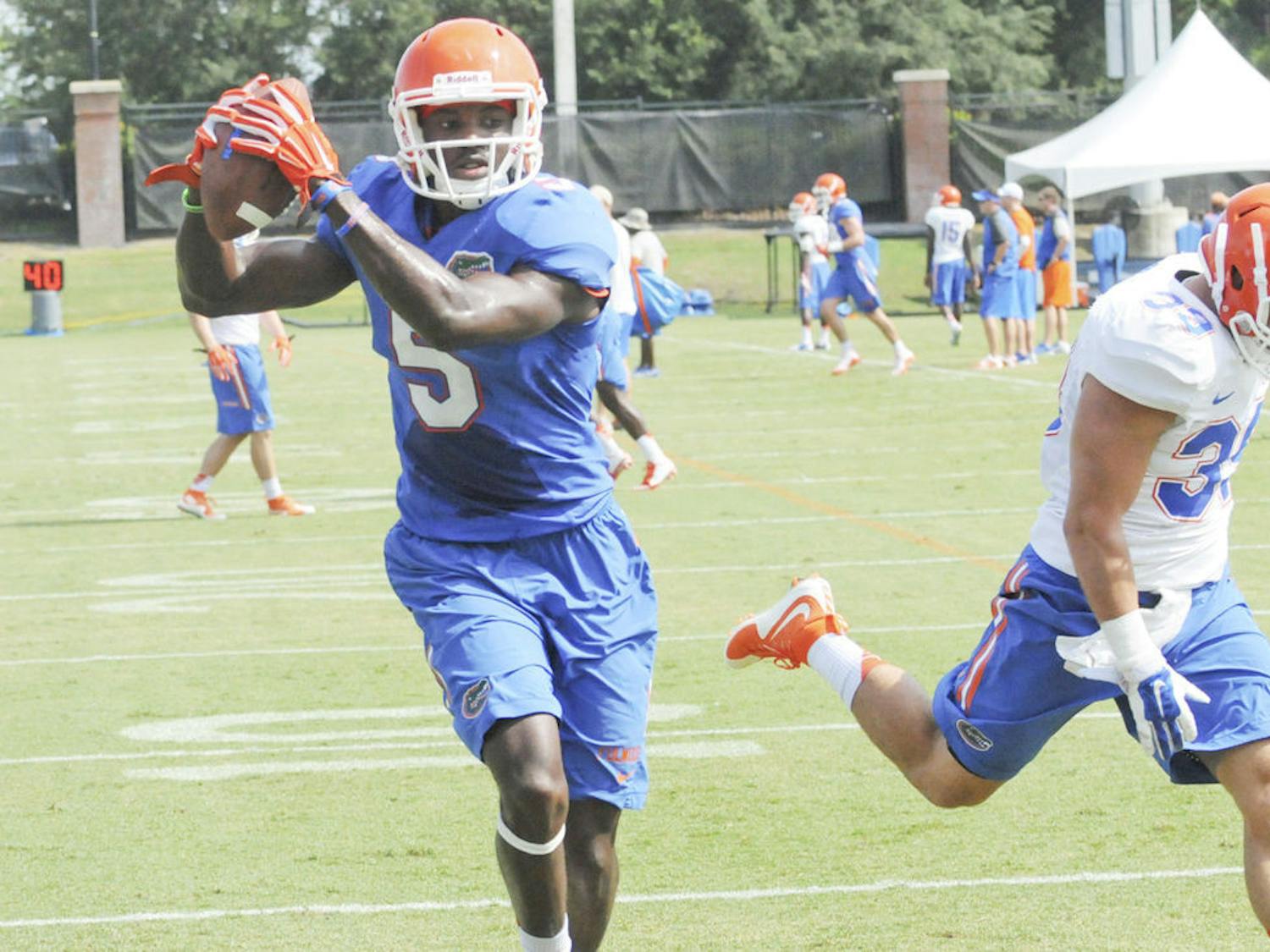 UF wide receiver Ahmad Fulwood catches a pass from quarterback Will Grier (not pictured) during practice Aug. 8, 2015, at Donald R. Dizney Stadium.