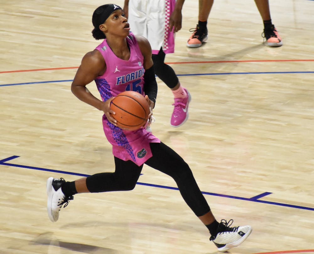 Nina Rickards drives into the lane during a Feb 12, 2021 game against Kentucky. The Gators wore their pink uniforms Thursday night. 