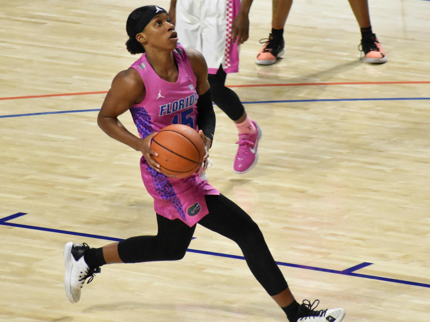 Nina Rickards drives into the lane during a Feb 12, 2021 game against Kentucky. The Gators wore their pink uniforms Thursday night. 