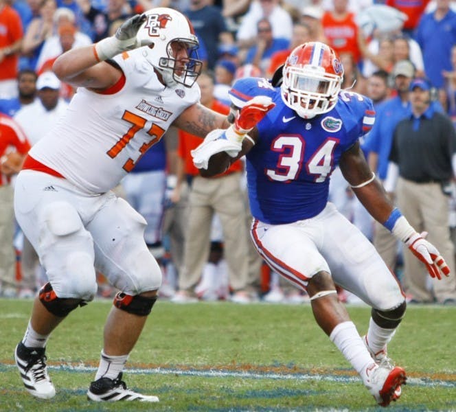 Lerentee McCray gets by Jordon Roussos of Bowling Green at Ben Hill Griffin Stadium during the season opener Sept. 1. McCray took over the Buck position when Ronald Powell suffered a torn ACL in the spring game.