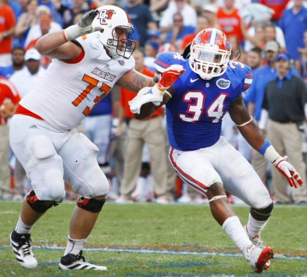 <p>Lerentee McCray gets by Jordon Roussos of Bowling Green at Ben Hill Griffin Stadium during the season opener Sept. 1. McCray took over the Buck position when Ronald Powell suffered a torn ACL in the spring game.</p>