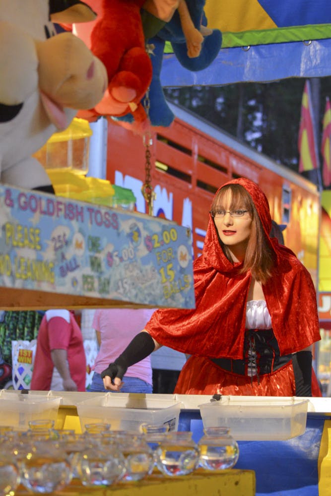 Emily Padot, 18, tries her hand at the Alachua County Fair’s Ring &amp; Goldfish Toss. The Alachua County Fair is being held at the Alachua County Fairgrounds at&nbsp; 3100 NE 39th Ave. and will continue to run until Saturday.