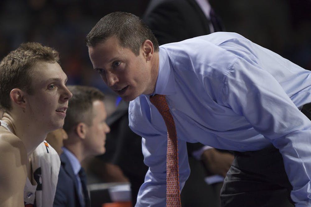 <p>UF coach Mike White speaks with guard Canyon Barry during Florida's 71-62 win against Texas A&amp;M on Feb. 11, 2017, in the O'Connell Center.</p>