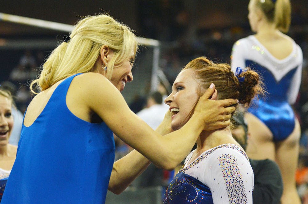 <p>UF coach Rhonda Faehn (left) celebrates with Bridget Sloan during the 2015 Southeastern Conference Championships on March 21 in Duluth, Georgia.</p>