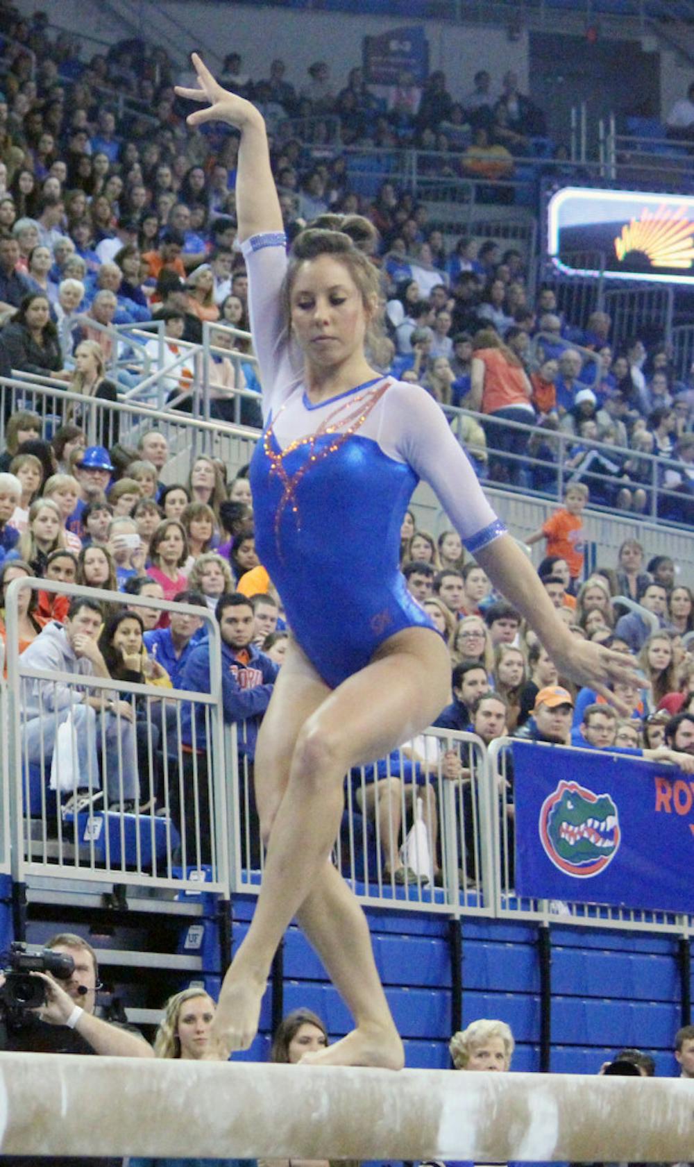 <p>Alaina Johnson performs a beam routine during Florida’s win against Oklahoma on Jan. 31 in the O’Connell Center.</p>