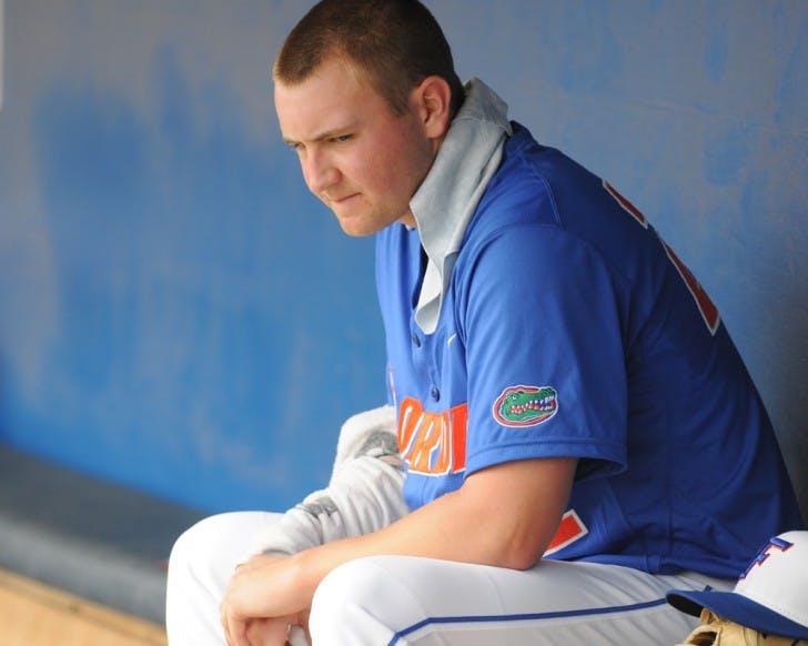 Starter Karsten Whitson sits in the Gators’ dugout following a game against USF last season. Whitson has not pitched since an abbreviated outing on Feb. 26.