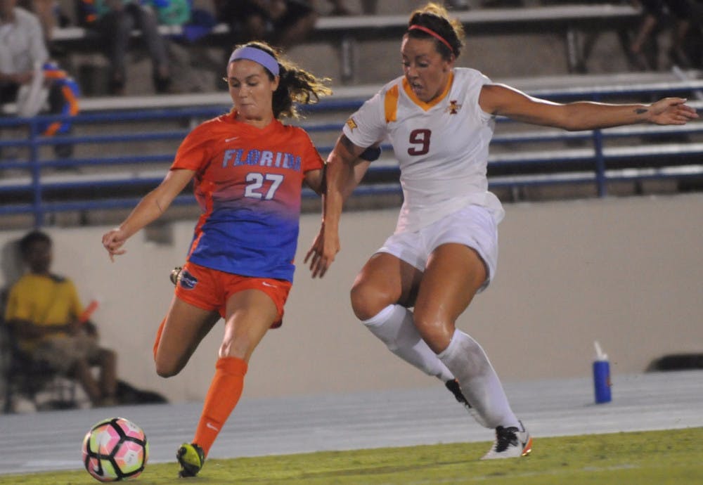 <p>UF midfielder Mayra Pelayo passes the ball during Florida's 5-2 win against Iowa State on Aug. 19, 2016, at James G. Pressly Stadium.</p>