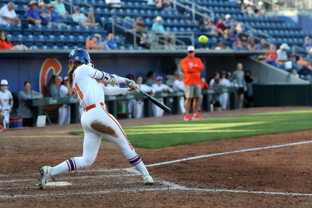 <p>Florida outfielder Taylor Shumaker (21) hits her second home run of the game against Longwood at Katie Seashole Pressly Stadium in Gainesville, Fla., on Friday, Feb. 20, 2025.</p>
