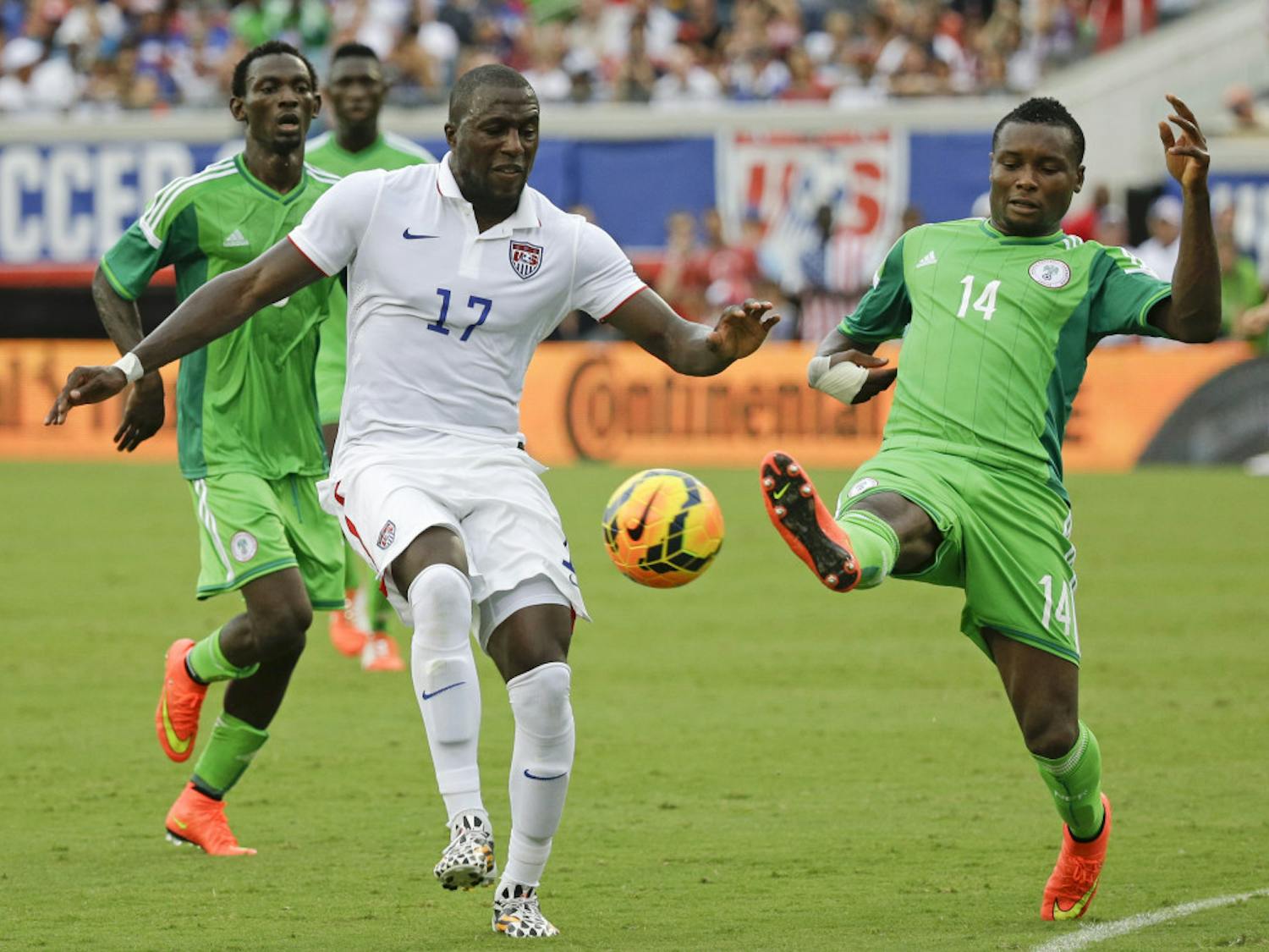 United States' Jozy Altidore (17) and Nigeria's GoDrey Oboabona (14) vie for control of the ball during the second half of an international friendly soccer match on Saturday in Jacksonville, Fla. The United States won 2-1.