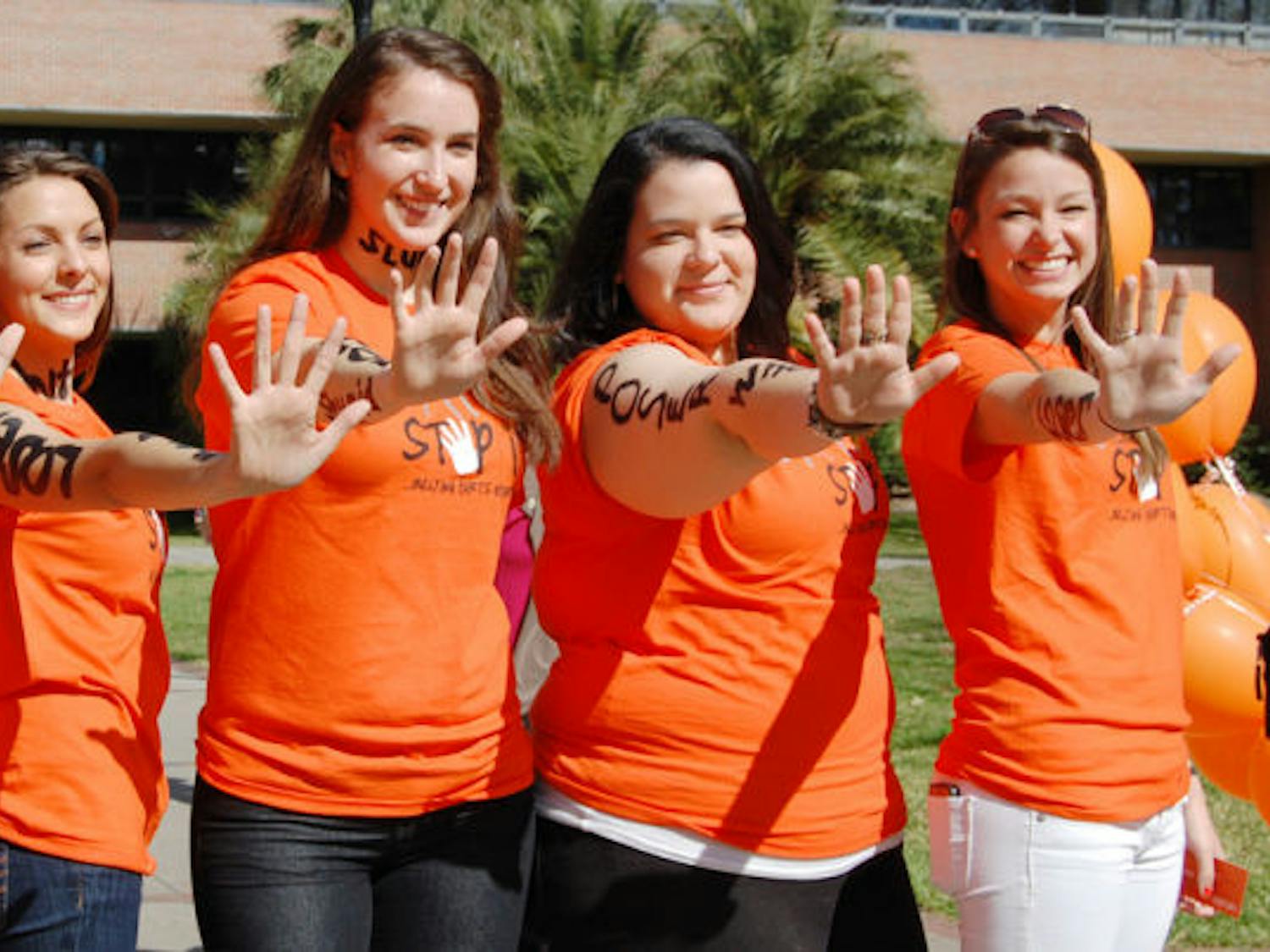 Members of UF’s Bateman Team strike their signature pose during the “Spot It, Stop It” anti-bullying campaign Tuesday afternoon on the Reitz Union North Lawn.