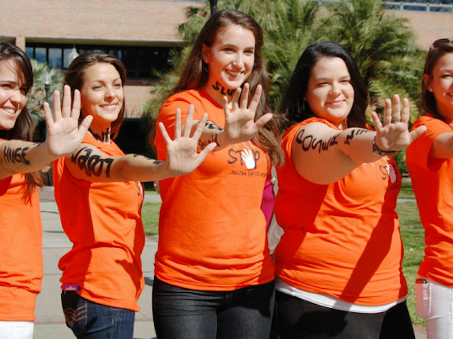 Members of UF’s Bateman Team strike their signature pose during the “Spot It, Stop It” anti-bullying campaign Tuesday afternoon on the Reitz Union North Lawn.