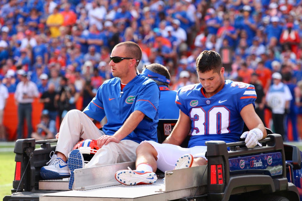 Special teams player Garrett Stephens gets carted off the field during Florida's 17-16 loss to LSU on Saturday at Ben Hill Griffin Stadium.