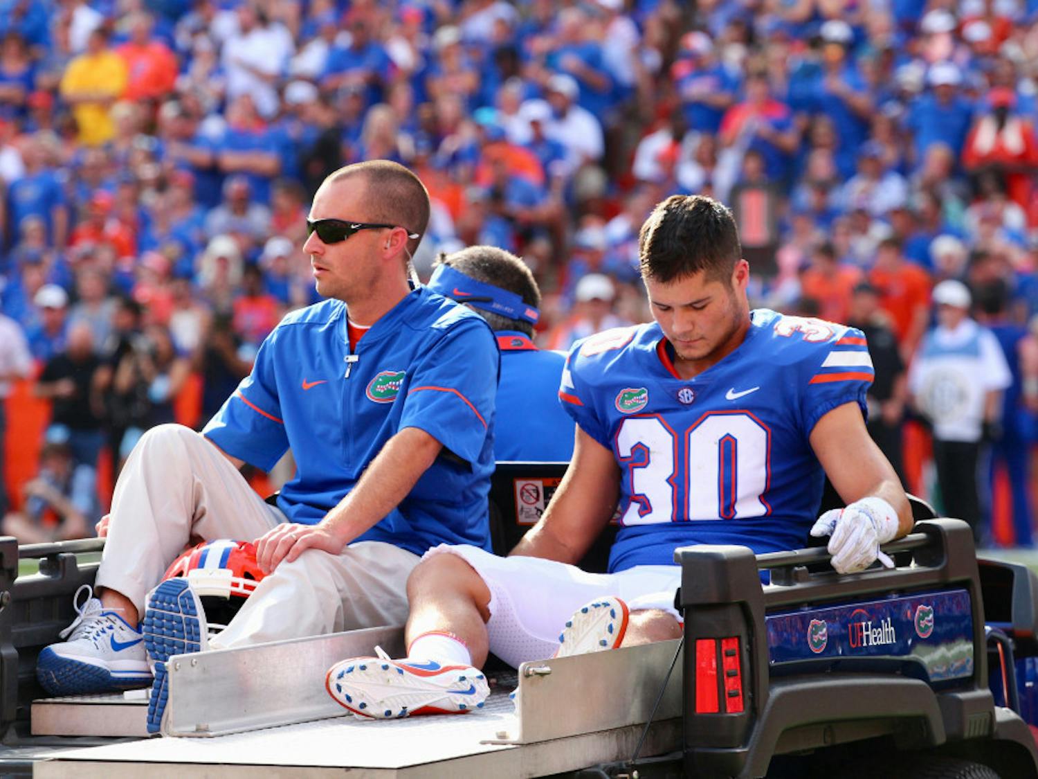 Special teams player Garrett Stephens gets carted off the field during Florida's 17-16 loss to LSU on Saturday at Ben Hill Griffin Stadium.