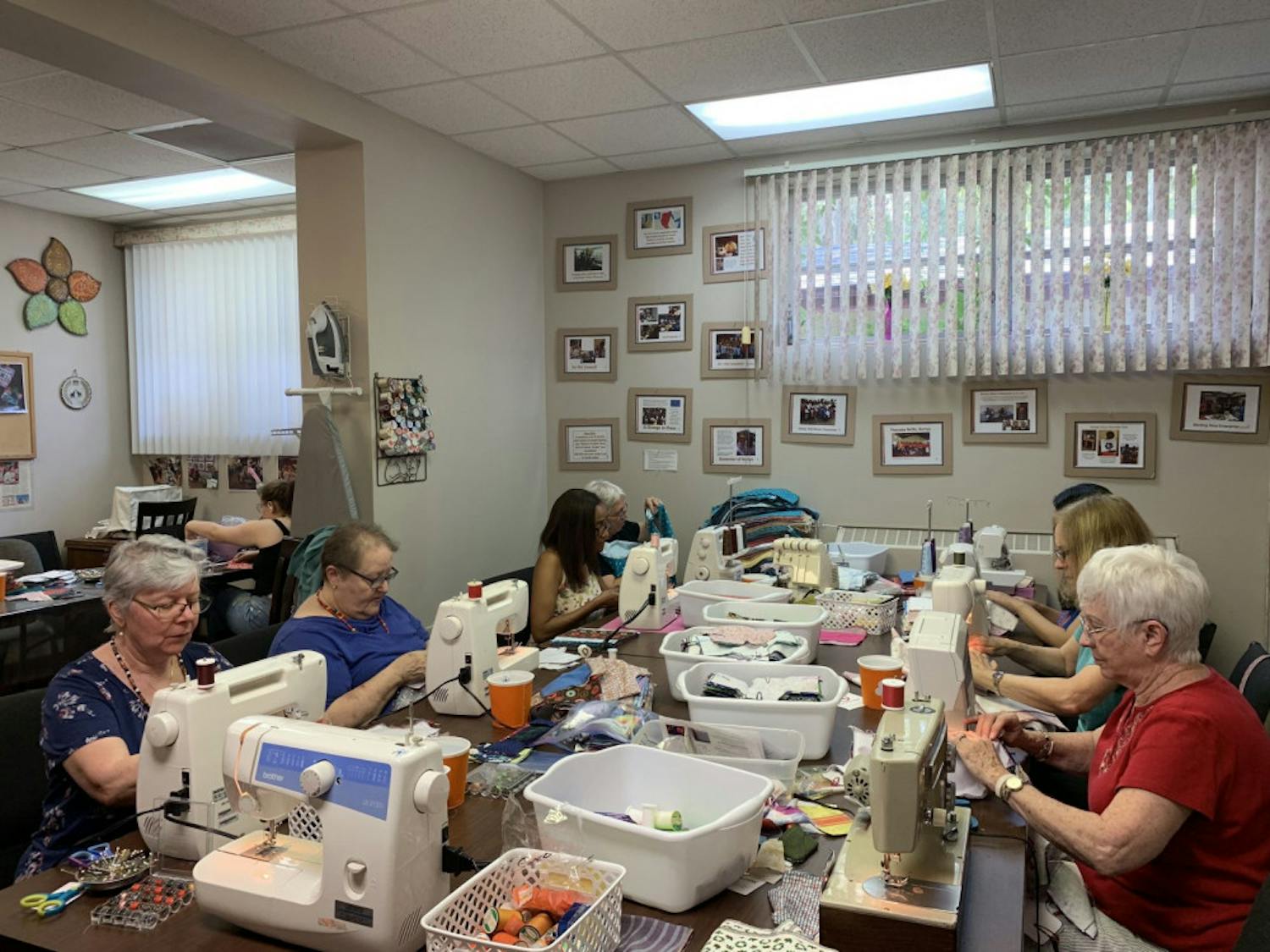 Volunteers work hard to sew reusable menstrual pads to help meet their goal of 200 kits.