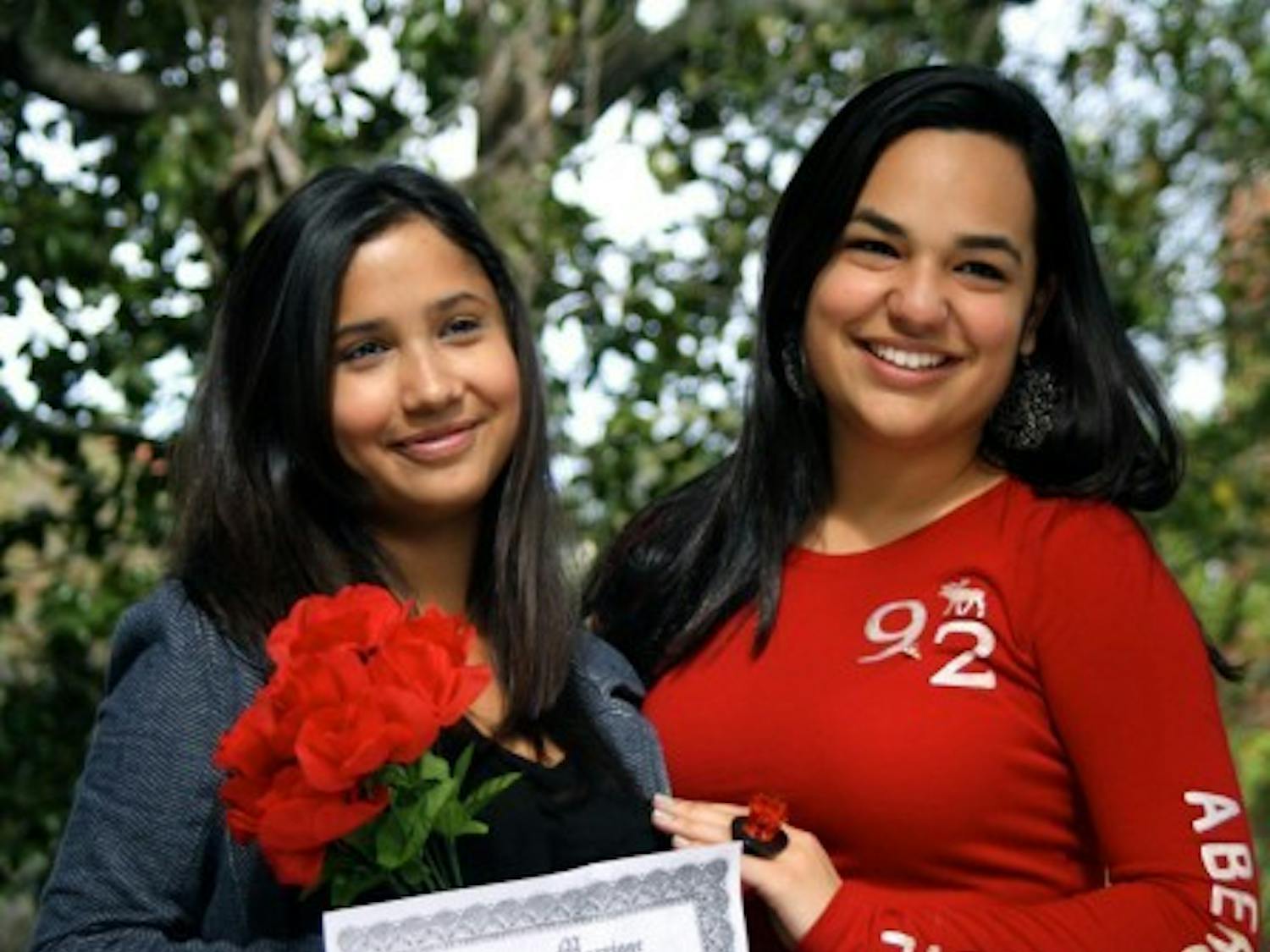 Biology freshman Daniela Sanchez and finance freshman Alejandra Miyares get married on the Plaza of the Americas on Tuesday afternoon. Delta Sigma Pi hosted the wedding ceremonies, complete with bridal bouquet, optional bow tie and Ring Pop exchange for a $3 donation to the American Cancer Society.