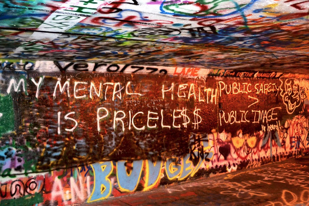 <p>Graffiti art touching on the topic of mental health adorns the walls of Norman Tunnel in November 2017.</p>