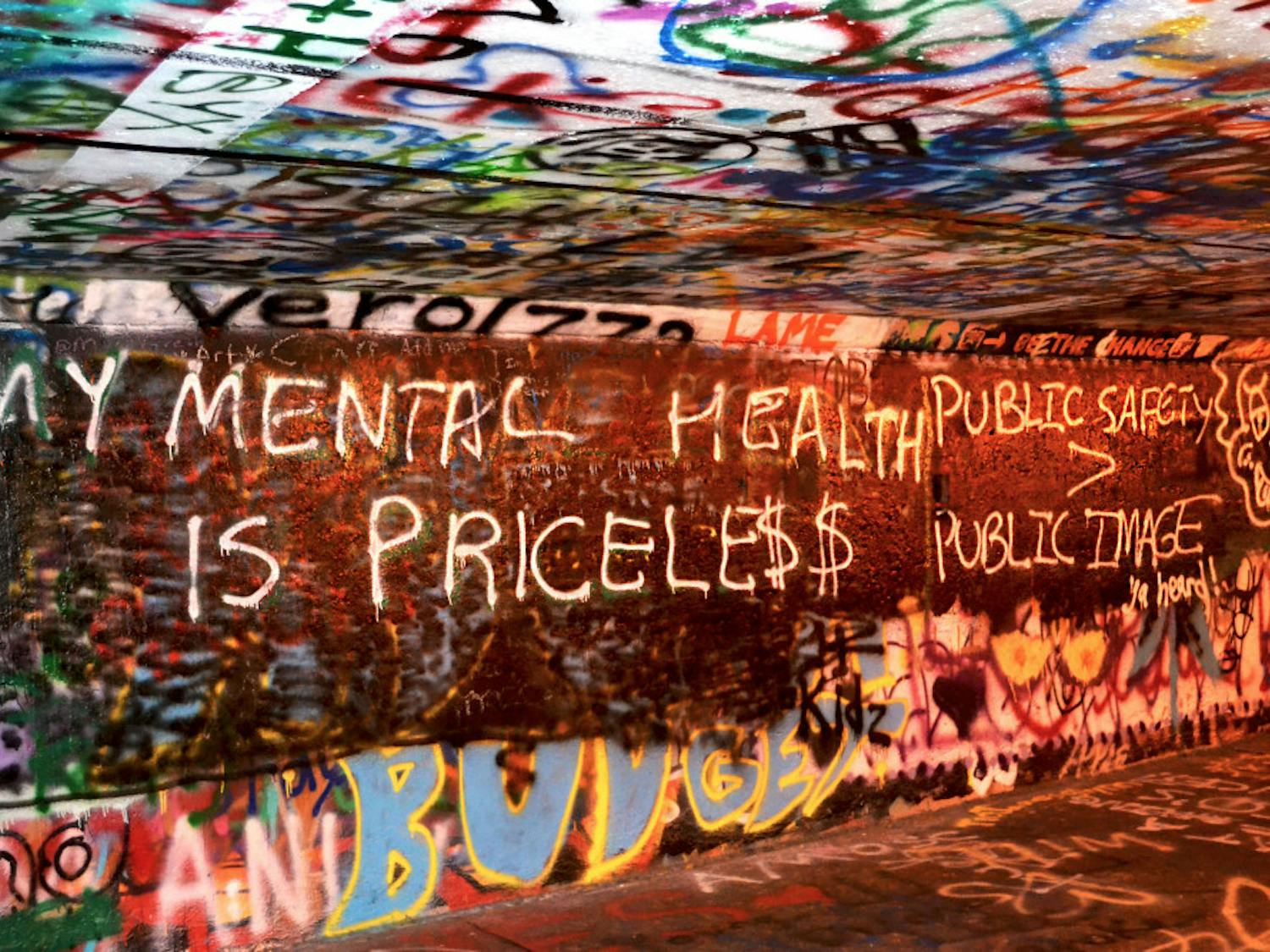 Graffiti art touching on the topic of mental health adorns the walls of Norman Tunnel in November 2017.