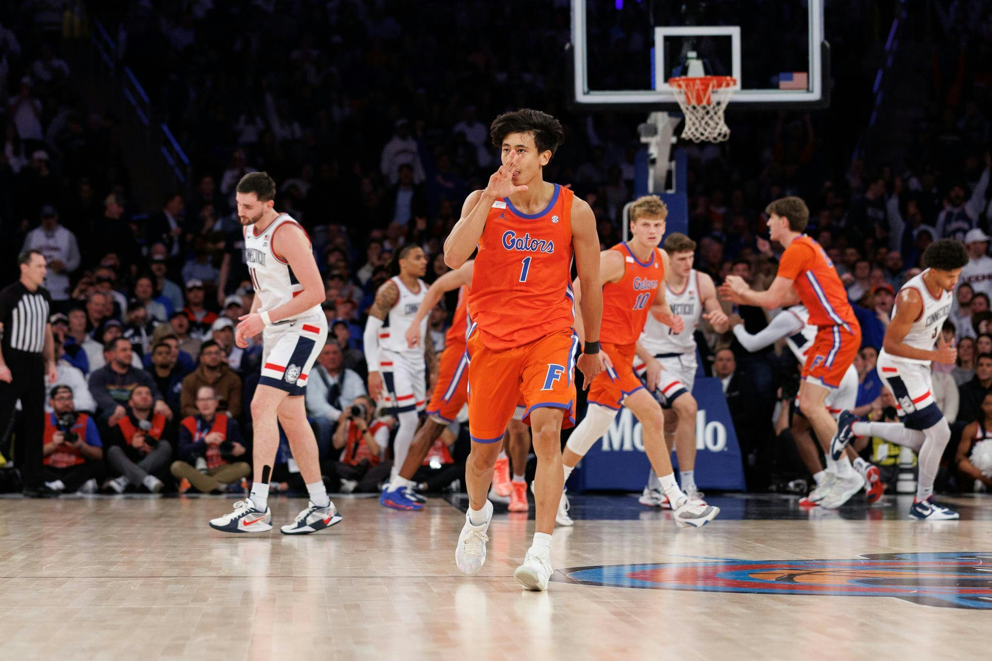 Florida Gators guard Xaivian Lee (1) celebrates a three point shot during the first half of an NCAA college basketball game between Florida and UConn on Tuesday, Dec. 09, 2025, in New York, N.Y.