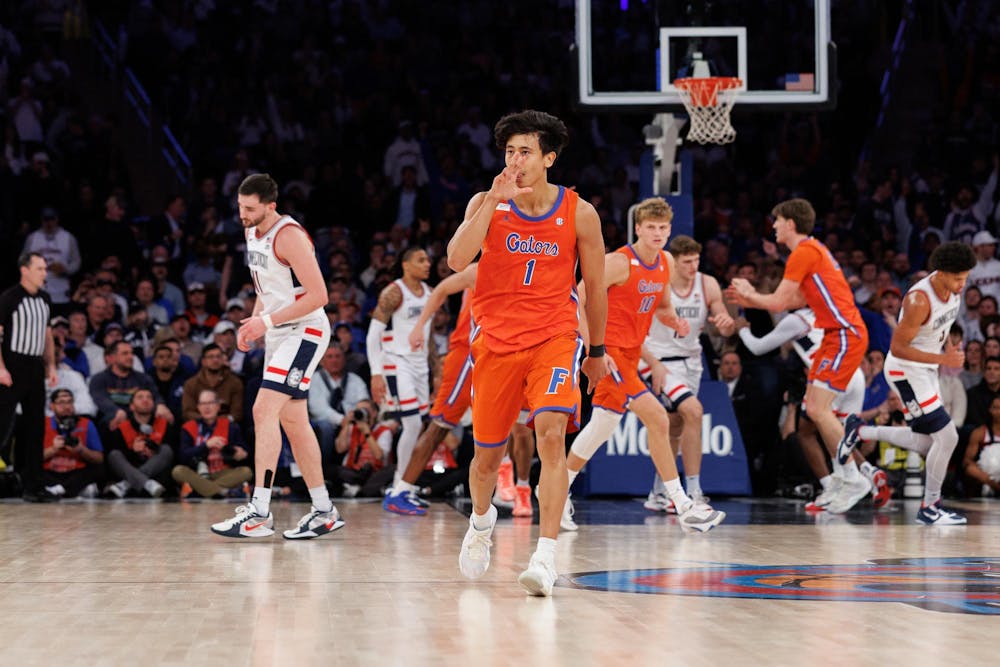 Florida Gators guard Xaivian Lee (1) celebrates a three point shot during the first half of an NCAA college basketball game between Florida and UConn on Tuesday, Dec. 09, 2025, in New York, N.Y.
