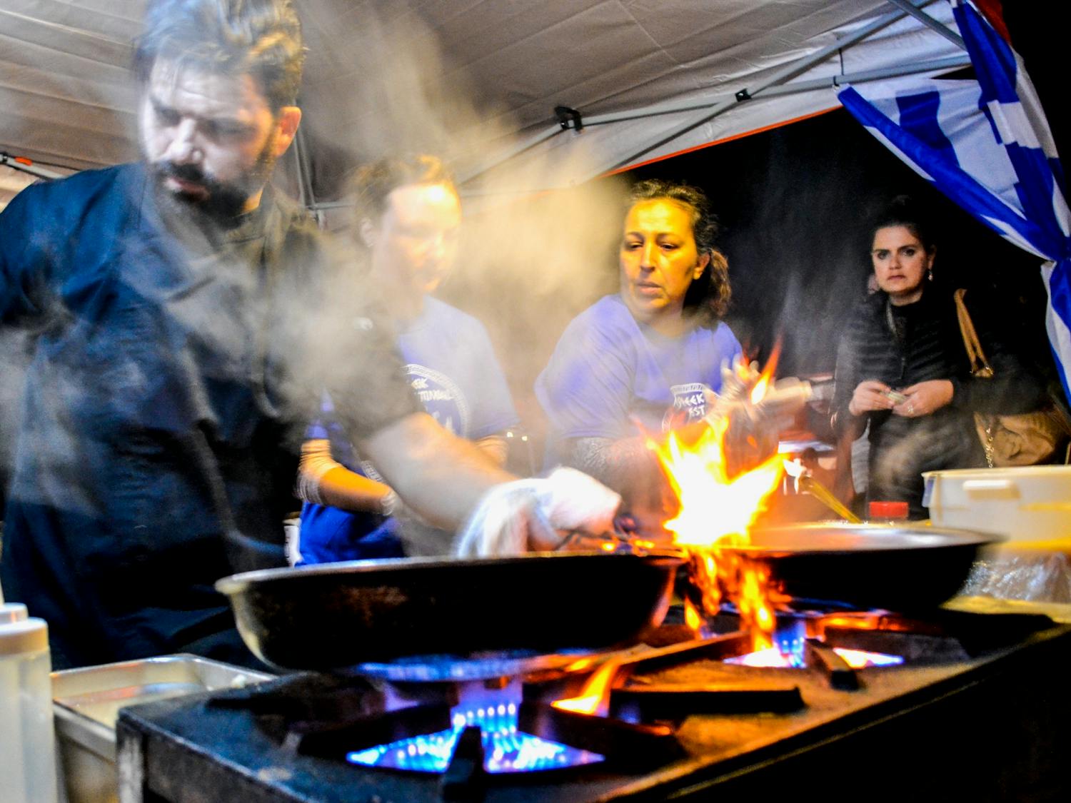 Demetrios Pyliotus, originally from southern Greece, prepares traditional Greek food at the Gainesville Greek Festival on Friday night. 