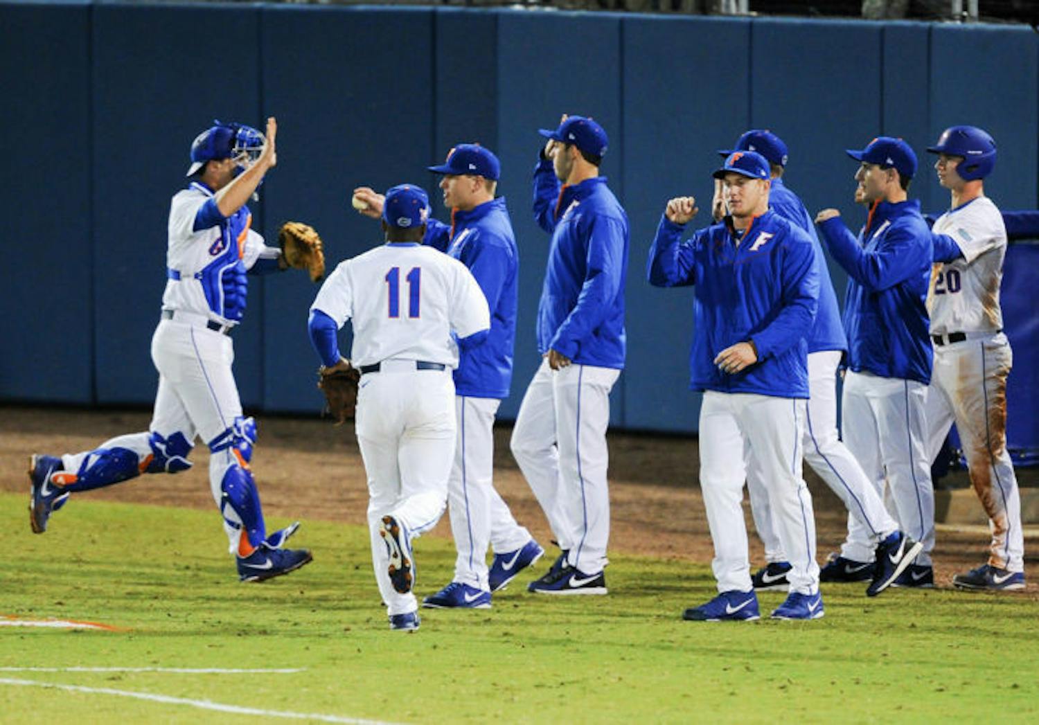 Florida celebrates after an inning during it’s 4-0 win against Maryland on Feb. 14 at McKethan Stadium.