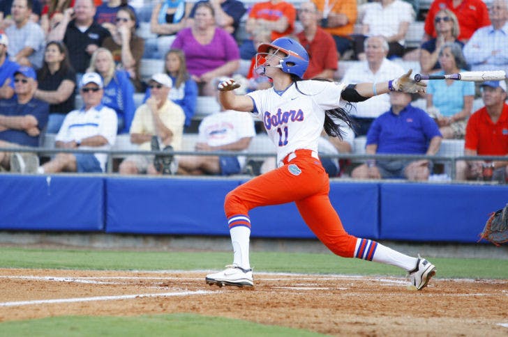 Senior Ensley Gammel (11)&nbsp; watches a fly ball off her bat during Florida’s 3-2 win against Auburn on April 13, 2012 at Katie Seashole Pressly Stadium. Gammel homered in a 14-3 win against Arizona on Sunday at the Kajikawa Classic.
