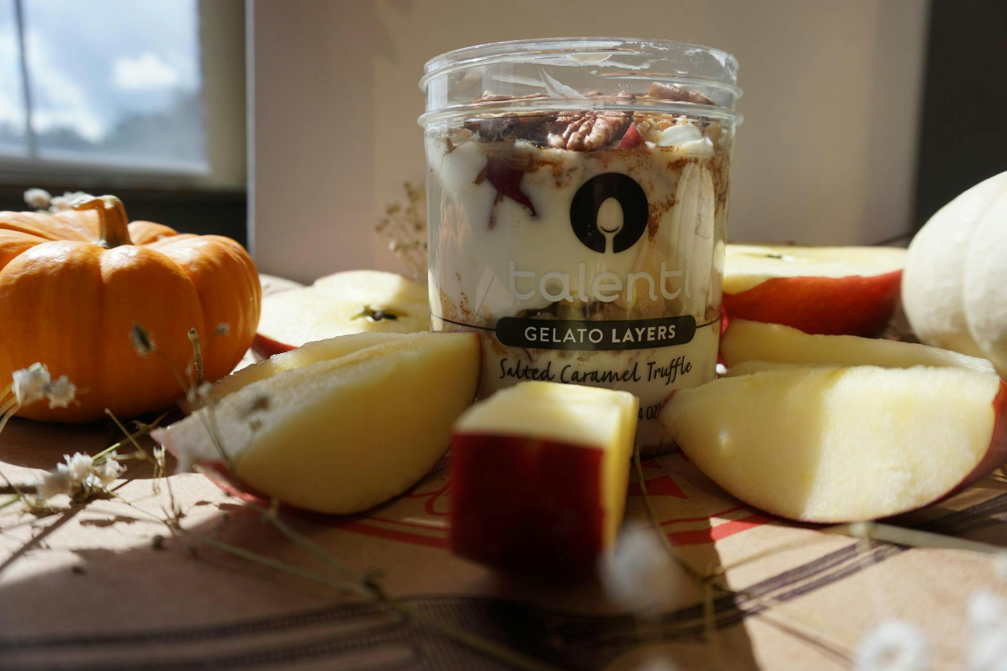 A spiced apple Crisp yogurt parfait pairs with an optional drizzle of maple syrup.