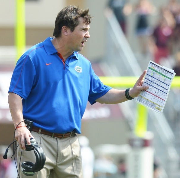 Florida head coach Will Muschamp speaks to a referee during at Kyle Field during Florida's 20-17 victory against Texas A&amp;M.