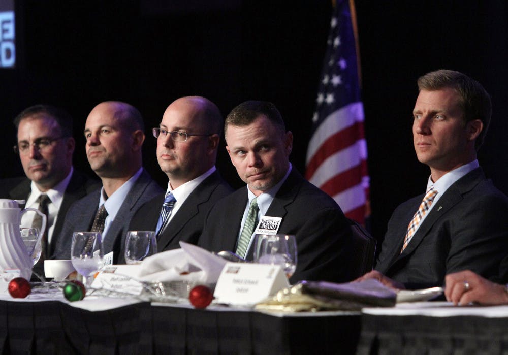 <p>Duke offensive coordinator Kurt Roper (middle) participates in the ceremony for the Broyles Award, which recognizes the top NCAA Division 1A Assistant Football Coaches, on Dec. 10 in Little Rock, Ark. Florida announced Roper as its new offensive coordinator on Dec. 26.</p>