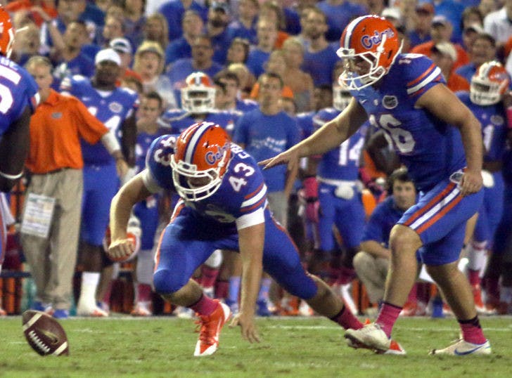 Austin Hardin (16) and sophomore holder Kyle Crofoot (43) scramble for the football after a blocked kick during Florida’s 30-10 victory against Arkansas on Saturday in Ben Hill Griffin Stadium.