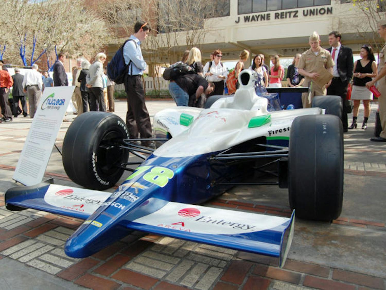 Passers-by gaze at the Nuclear Clean Air Energy car driven by IZOD IndyCar racer Simona De Silvestro, 24, displayed Tuesday afternoon on the Reitz Union North Lawn as part of KV Racing Technology and Entergy Nuclear teaming up to promote the "Nuclear Clean Air Energy" public awareness program.